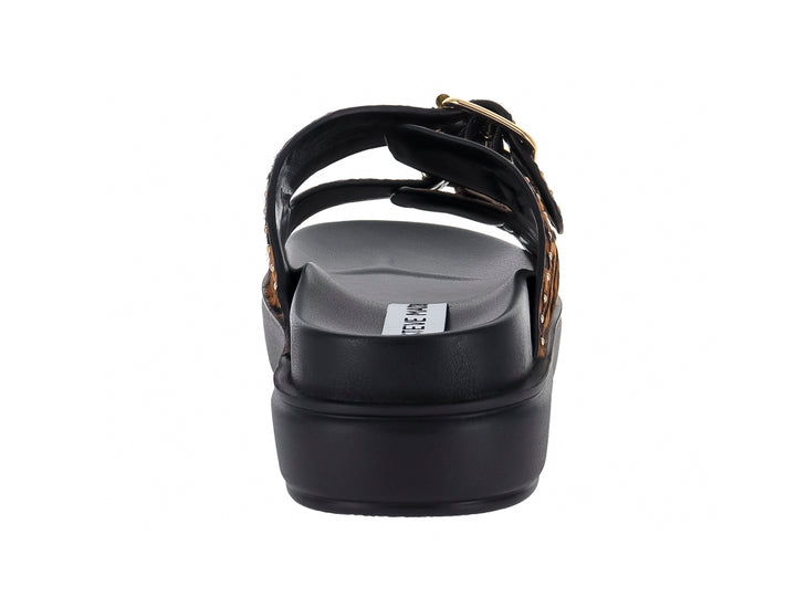 Sandalias de plataforma Steve Madden con estampado de leopardo, hebillas doradas y suela negra gruesa.
