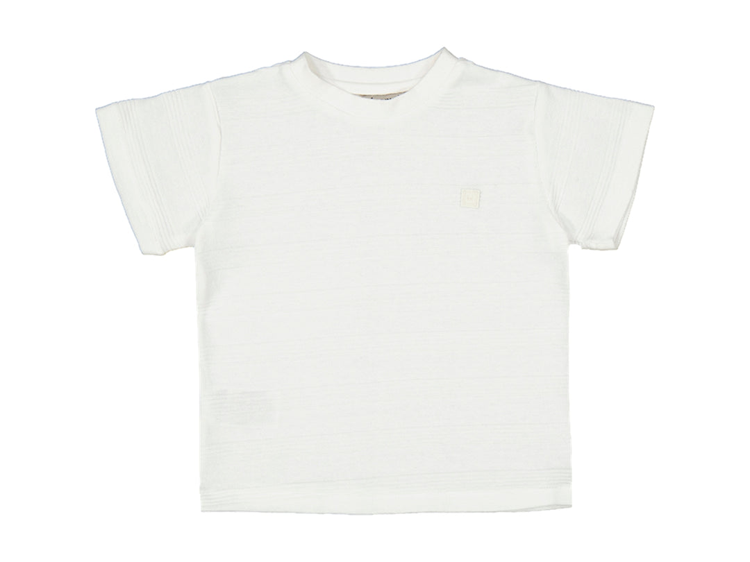Camiseta de color nata para bebé o niño con cuello redondo y manga corta.