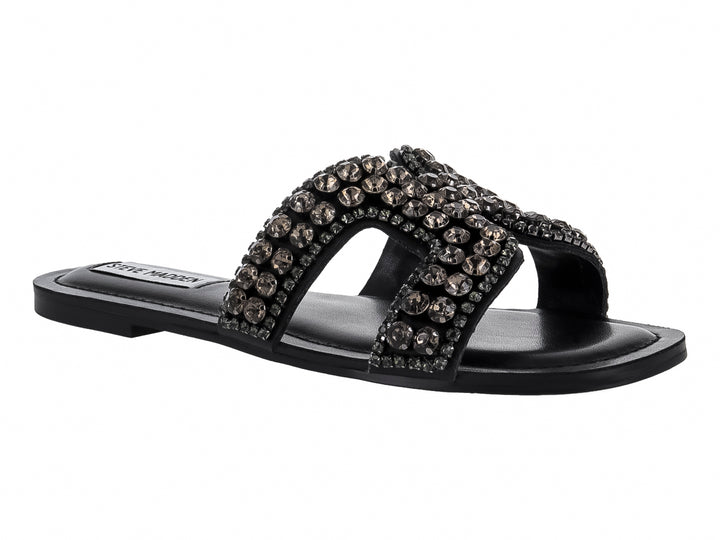 Sandalia plana negra con correa ancha adornada con cristales brillantes de la marca Steve Madden.