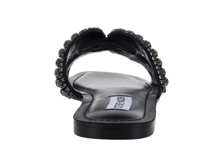 Sandalia plana negra con correa ancha adornada con cristales brillantes de la marca Steve Madden.