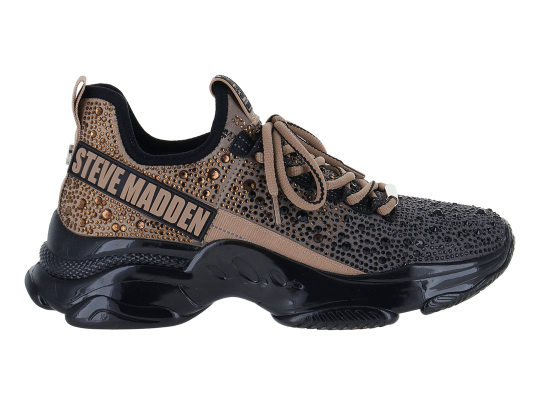 Tenis Steve Madden Mistic en color negro y dorado con suela chunky brillante.