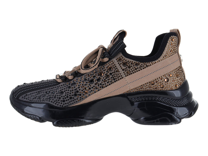 Tenis Steve Madden Mistic en color negro y dorado con suela chunky brillante.