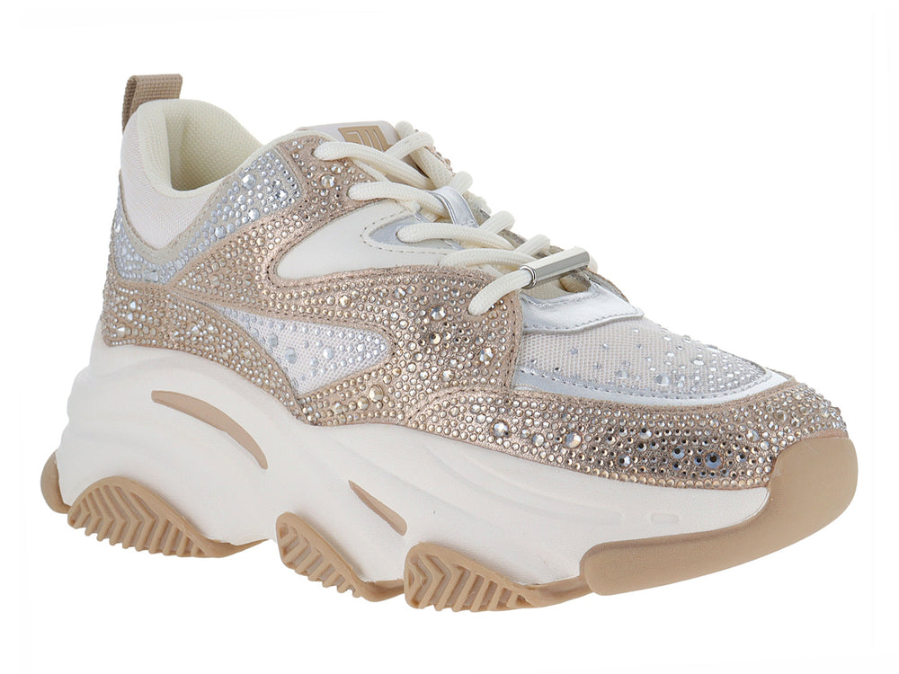 Tenis chunky Steve Madden con acabado brillante en plata y dorado y suela blanca gruesa.