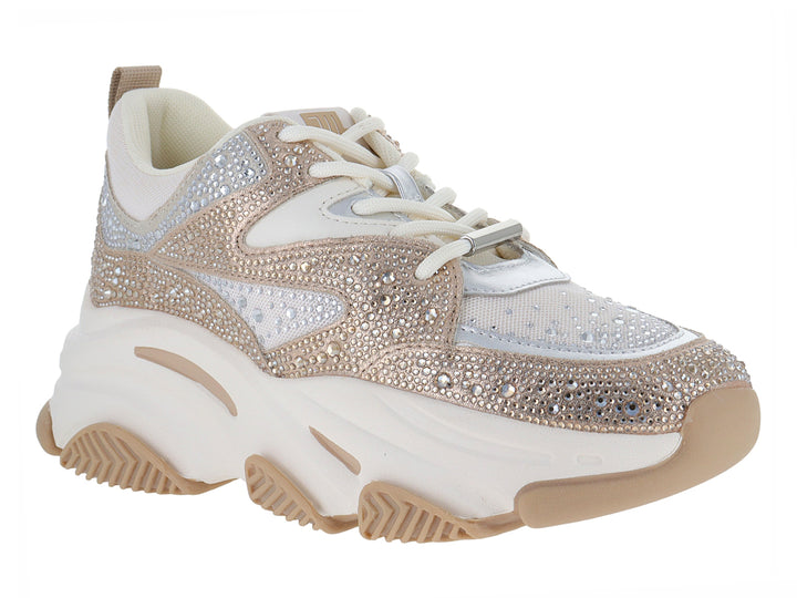 Tenis chunky Steve Madden con acabado brillante en plata y dorado y suela blanca gruesa.