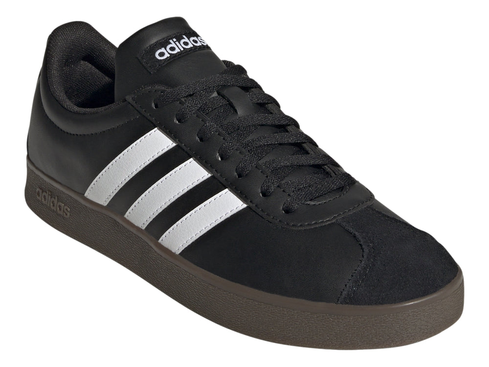 Tenis Adidas color negro con tres franjas blancas laterales y suela oscura.