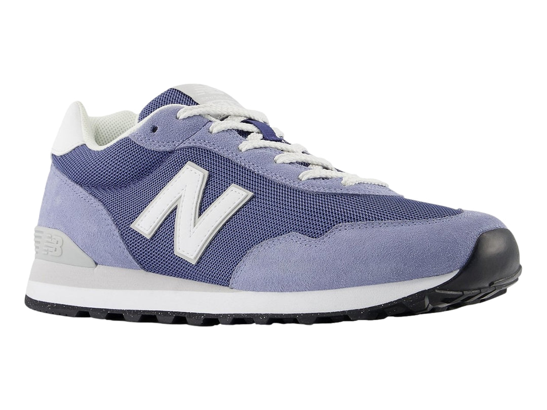 Tenis New Balance ML 515 en colores azul marino y azul claro con suela blanca.