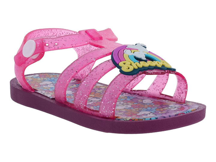 Sandalia infantil color rosa con glitter y suela morada.