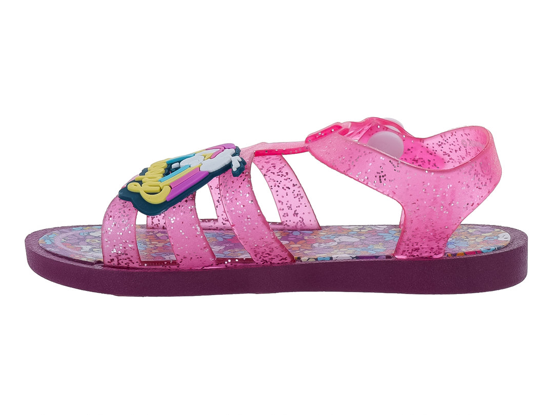 Sandalia infantil color rosa con glitter y suela morada.