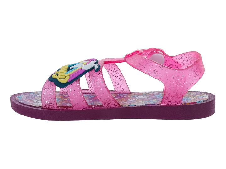 Sandalia infantil color rosa con glitter y suela morada.
