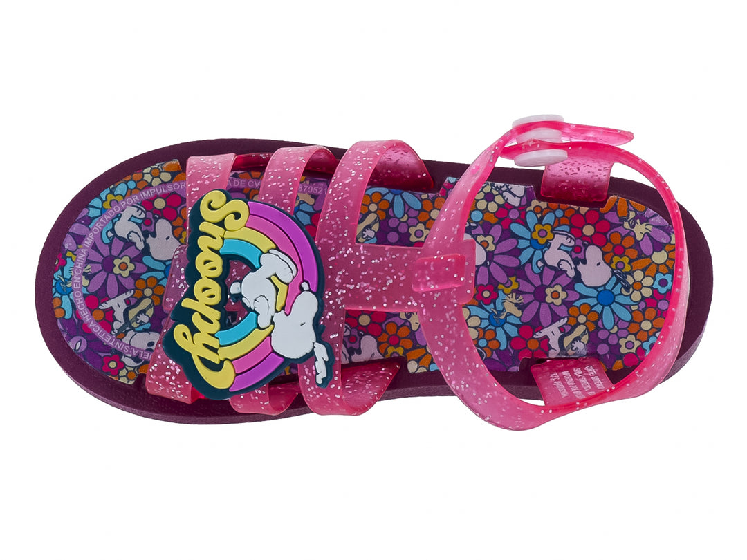Sandalia infantil color rosa con glitter y suela morada.