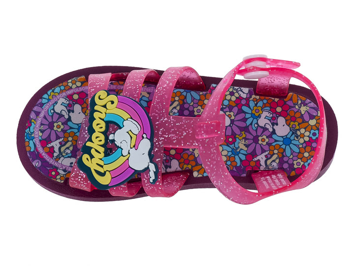 Sandalia infantil color rosa con glitter y suela morada.