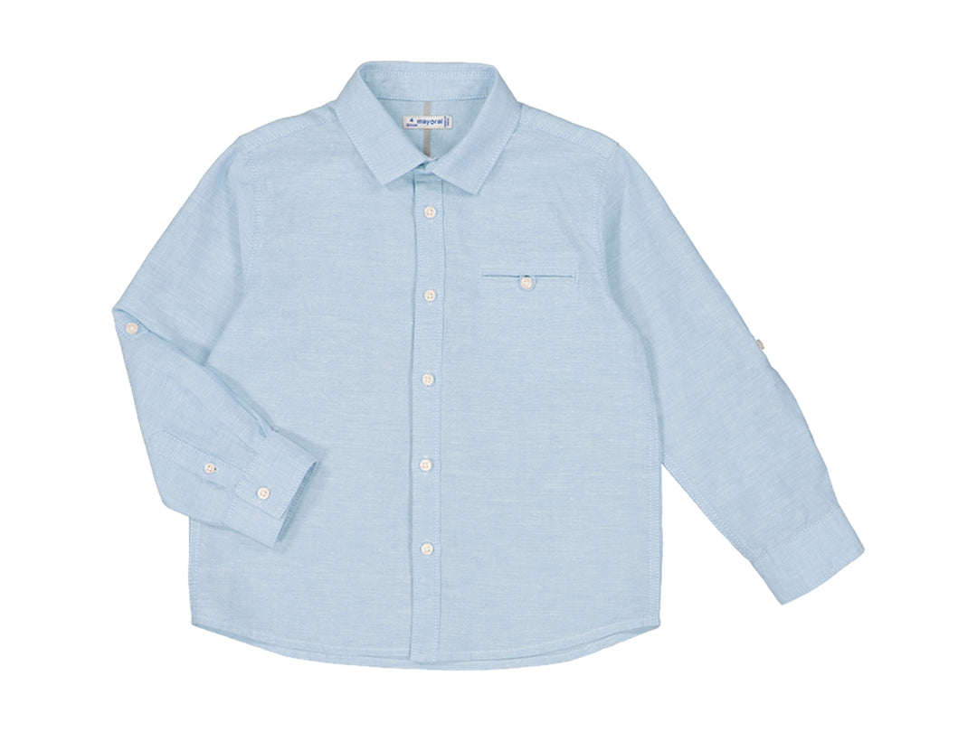 Camisa de lino color azul brisa para niño con manga larga y botones frontales.