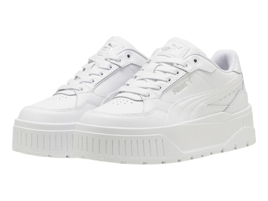 Tenis PUMA Carmen II Idol JR en color blanco con suela de plataforma gruesa y detalles en plata.