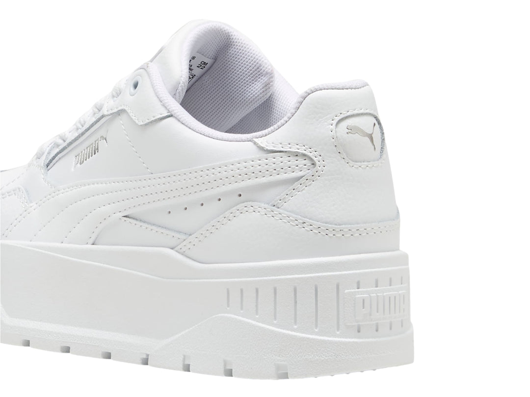 Tenis PUMA Carmen II Idol JR en color blanco con suela de plataforma gruesa y detalles en plata.