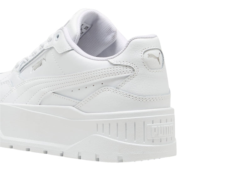 Tenis PUMA Carmen II Idol JR en color blanco con suela de plataforma gruesa y detalles en plata.