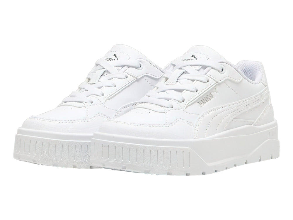 Tenis PUMA blancos con suela de plataforma gruesa para niños.