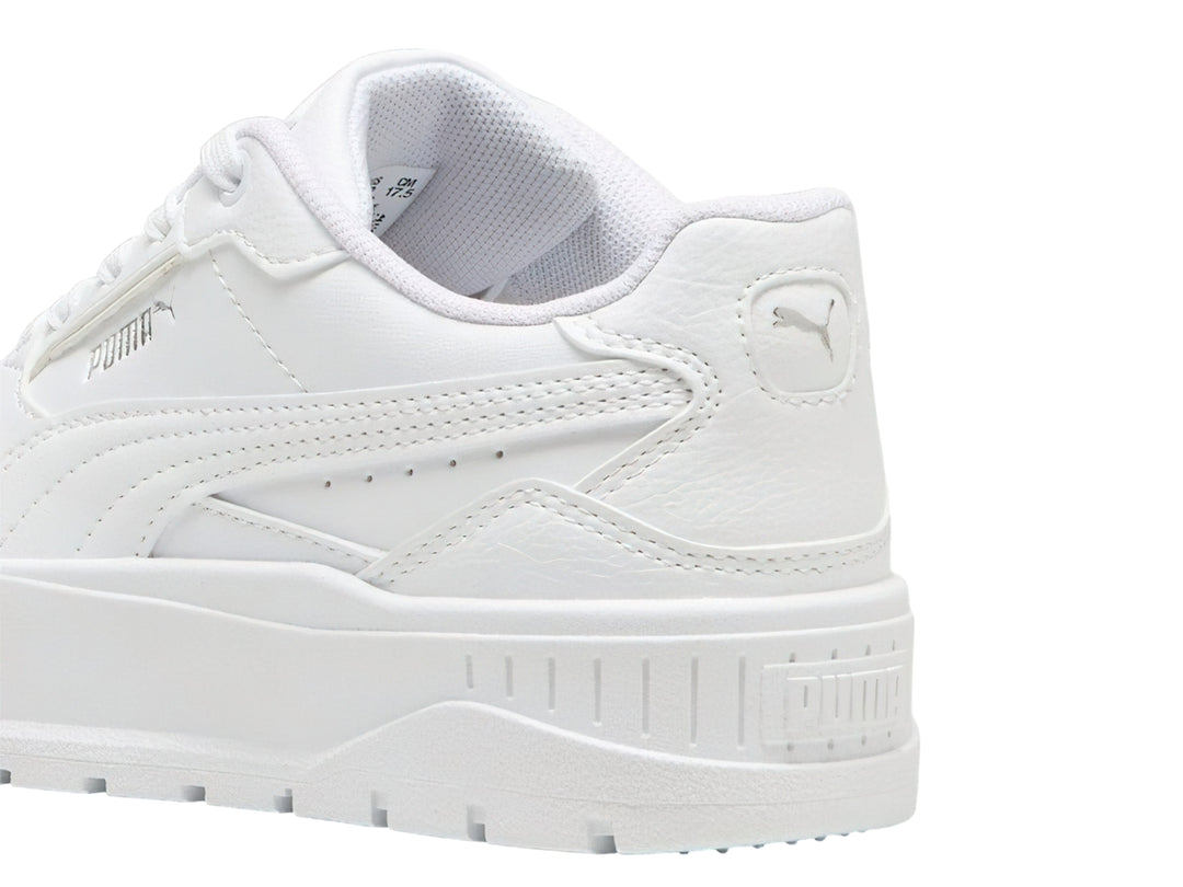 Tenis PUMA blancos con suela de plataforma gruesa para niños.