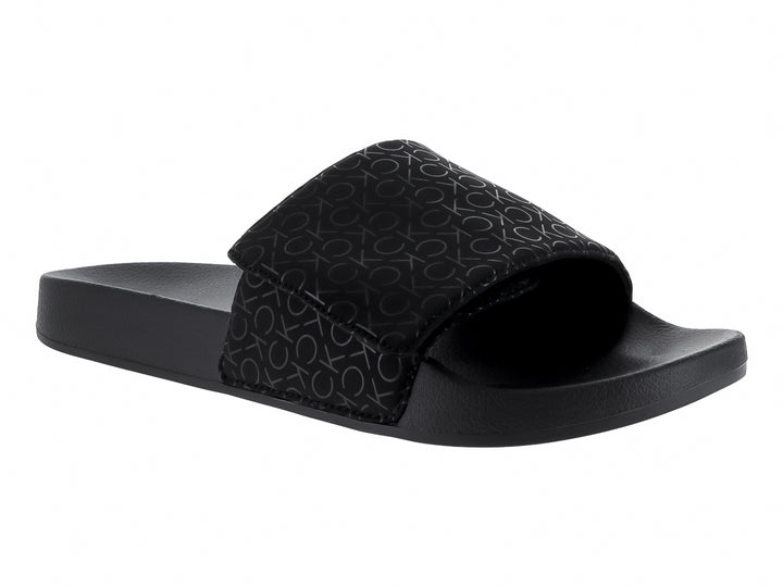 Sandalias slide negras de Calvin Klein con logotipo grabado en la banda superior y suela mate.