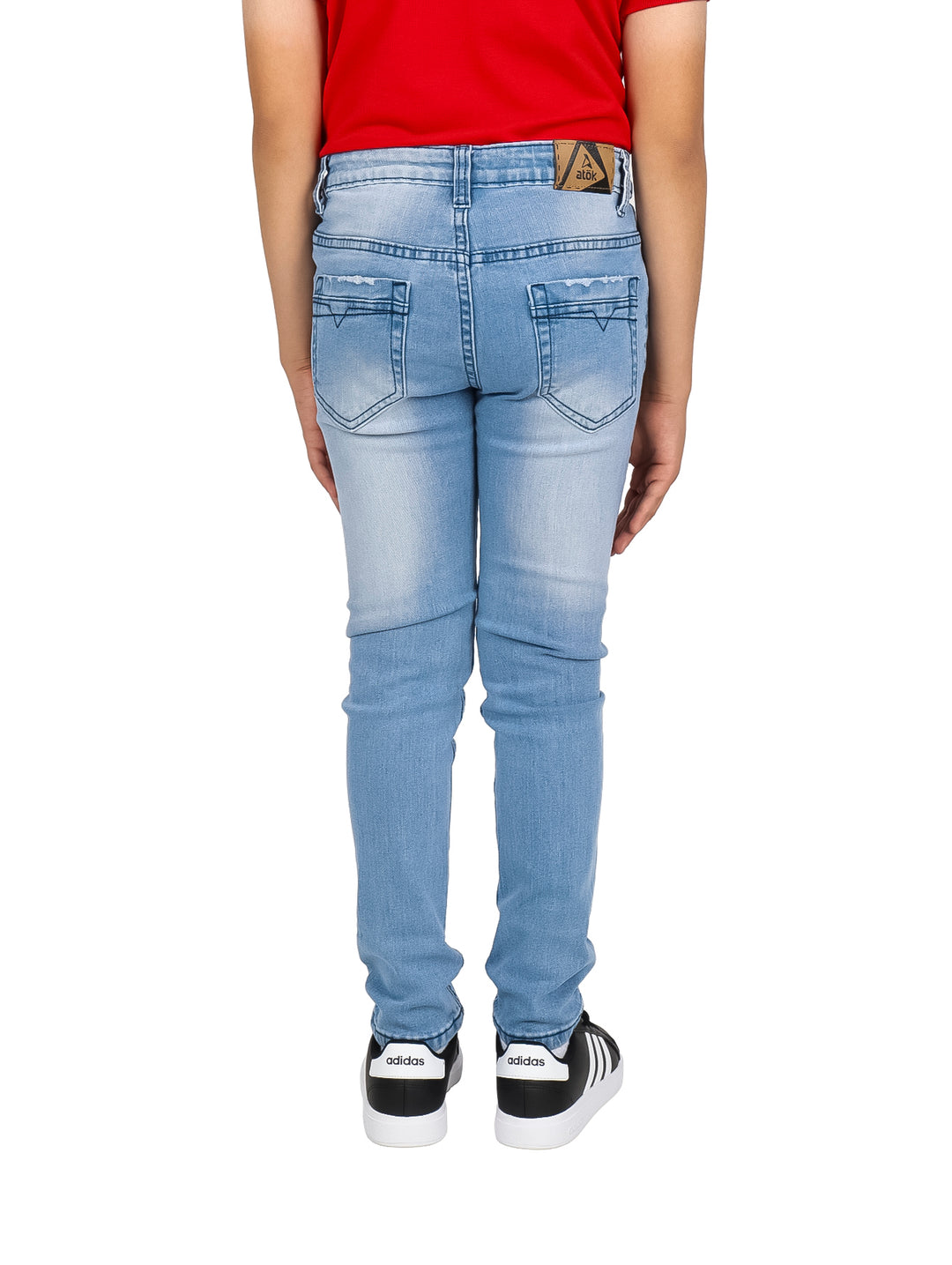 Pantalones vaqueros rectos en color azul denim deslavado para niño.