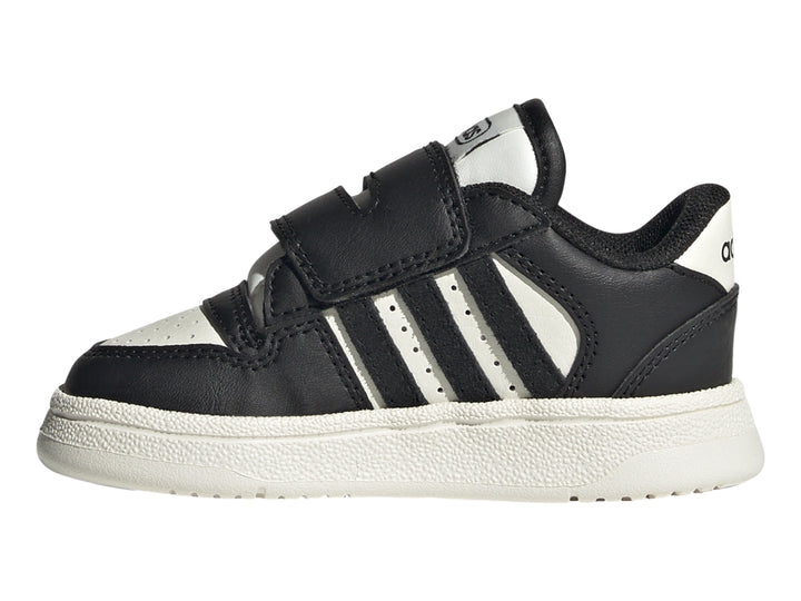 Tenis Adidas Break Start para niño en color negro con tres franjas blancas y cierre de velcro.