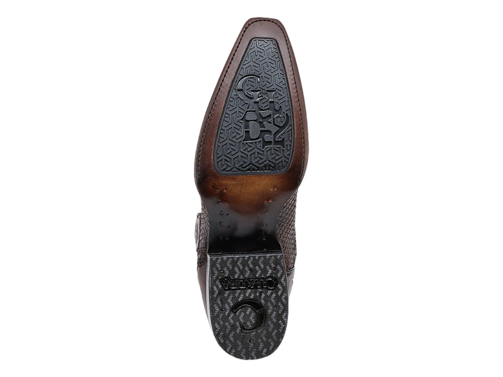 Bota vaquera de cuero color miel con detalle de piel de pitón en la punta y suela negra.