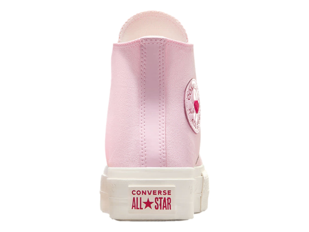 Tenis Converse botín color rosa con suela blanca y detalles decorativos.