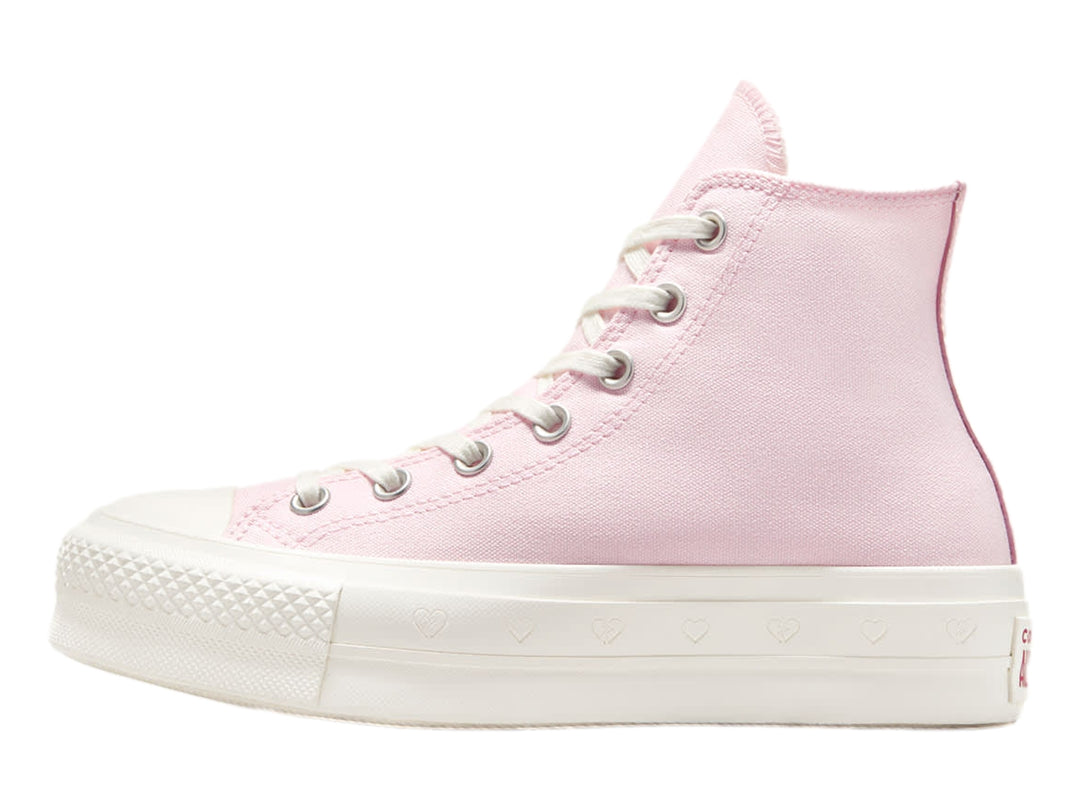 Tenis Converse botín color rosa con suela blanca y detalles decorativos.