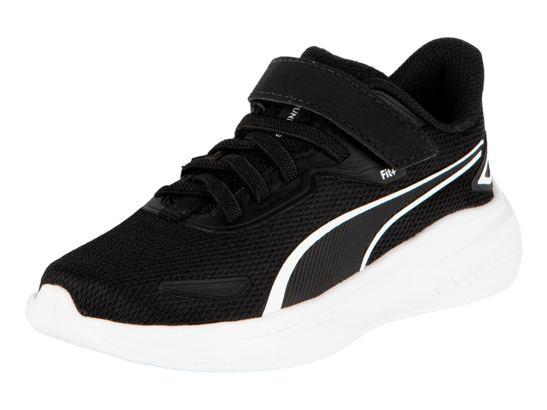 Tenis PUMA negros con suela blanca y correa de ajuste para niños.