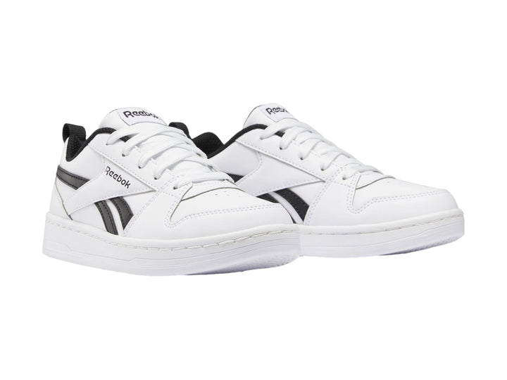 Tenis Reebok blancos con detalles en negro, diseño deportivo de corte bajo para niños.