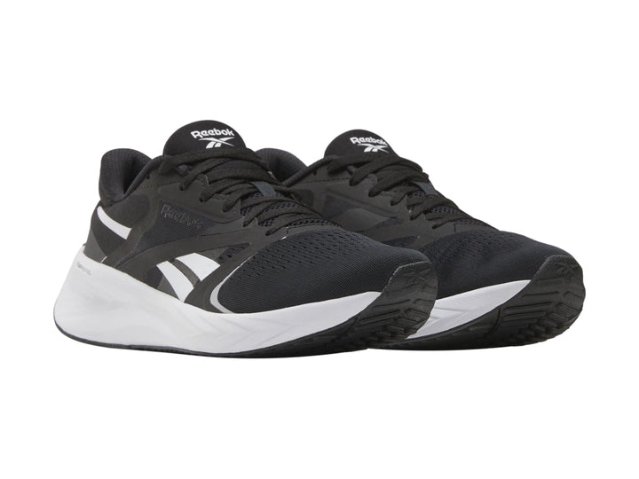 Tenis deportivos Reebok Energen Tech Plus 2 en color negro con suela y detalles en blanco.
