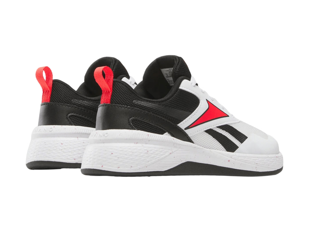 Tenis deportivos Reebok Nano Play en color blanco con detalles en negro y rojo para niños.