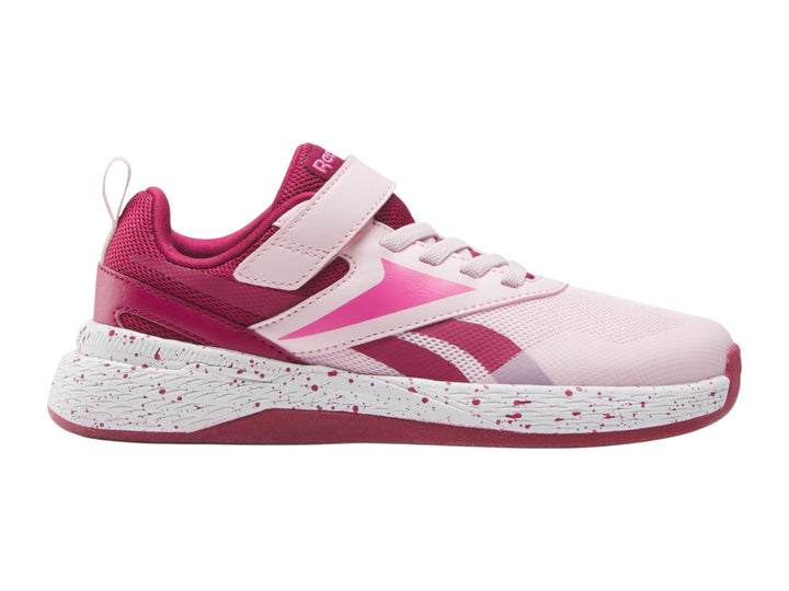 Tenis deportivos Reebok color rosa con suela blanca moteada y correa superior para Niña.
