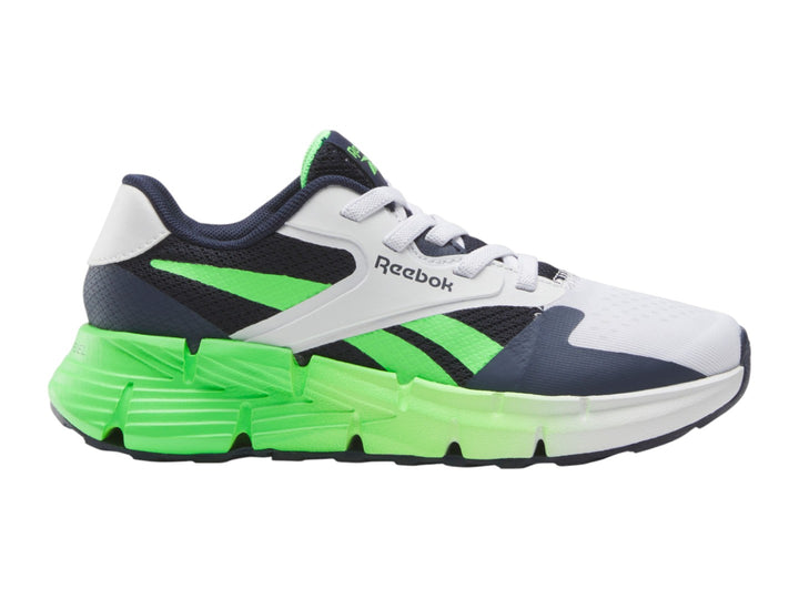 Tenis deportivos Reebok blancos con detalles en azul marino y suela verde neón.