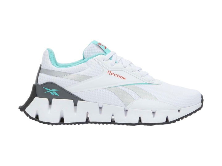 Tenis deportivos Reebok Zig Dynamica en color blanco con detalles en gris y turquesa.
