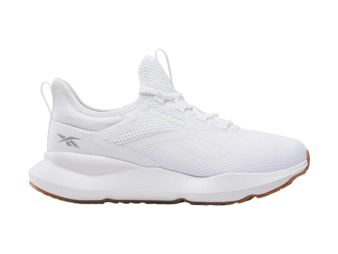 Tenis deportivos Reebok color blanco con suela color café.