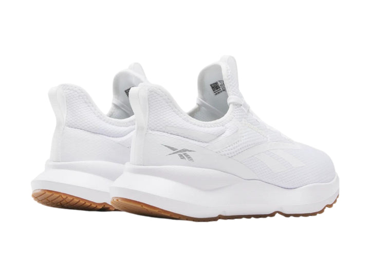 Tenis deportivos Reebok color blanco con suela color café.