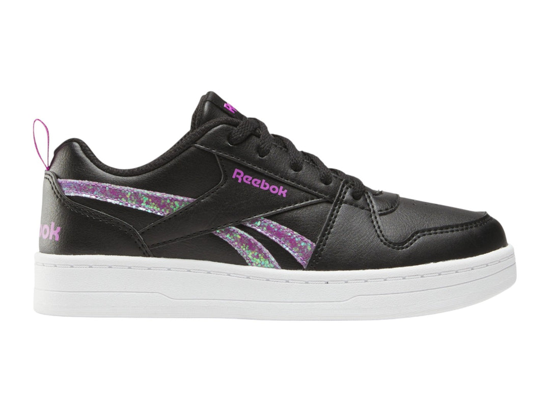 Tenis Reebok negros con suela blanca y detalles laterales en morado brillante.