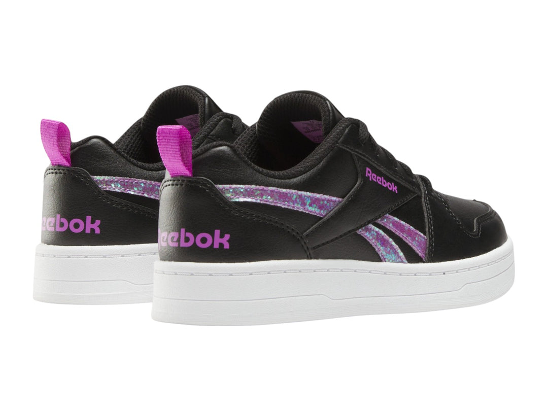 Tenis Reebok negros con suela blanca y detalles laterales en morado brillante.