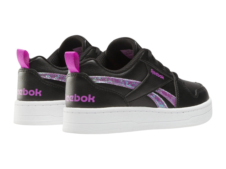 Tenis Reebok negros con suela blanca y detalles laterales en morado brillante.