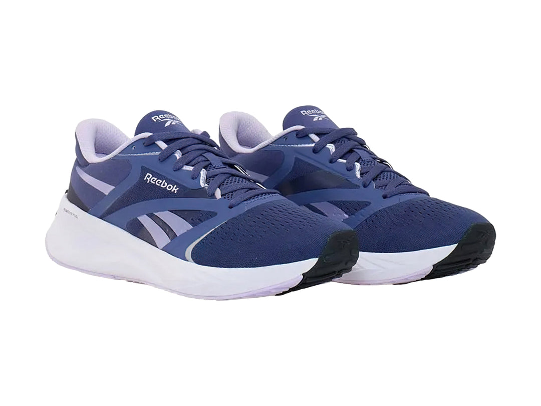 Tenis deportivos Reebok color azul con suela blanca y detalles en azul claro.