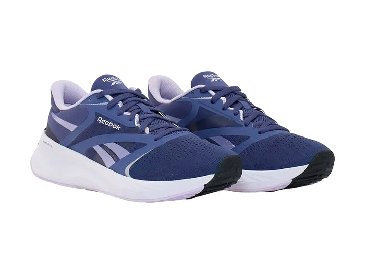 Tenis deportivos Reebok color azul con suela blanca y detalles en azul claro.