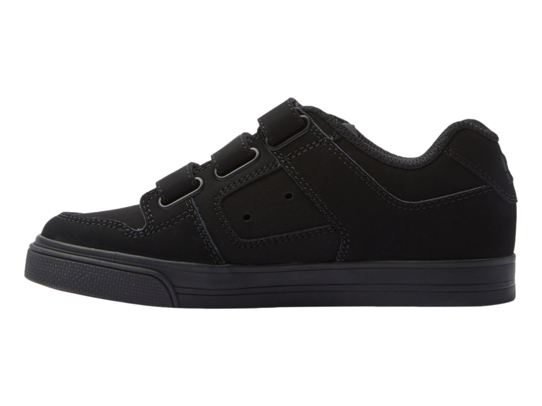 Zapato deportivo DC Shoes color negro con cierre de tres tiras de velcro.