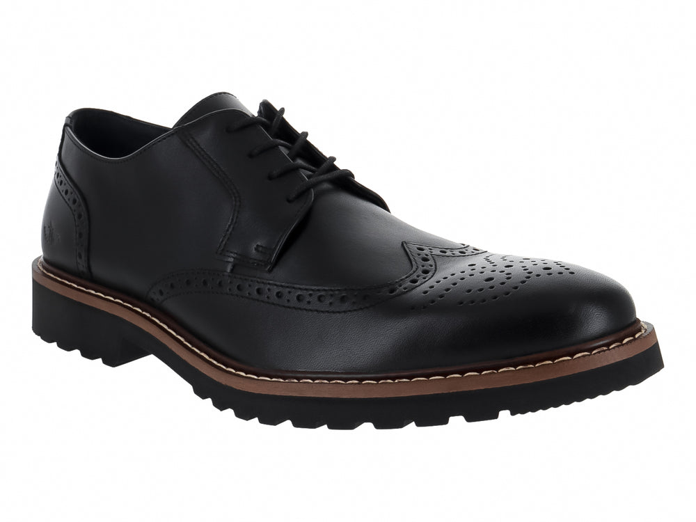 Zapato Oxford negro de cuero con detalles perforados tipo brogue y suela gruesa color café y negro.