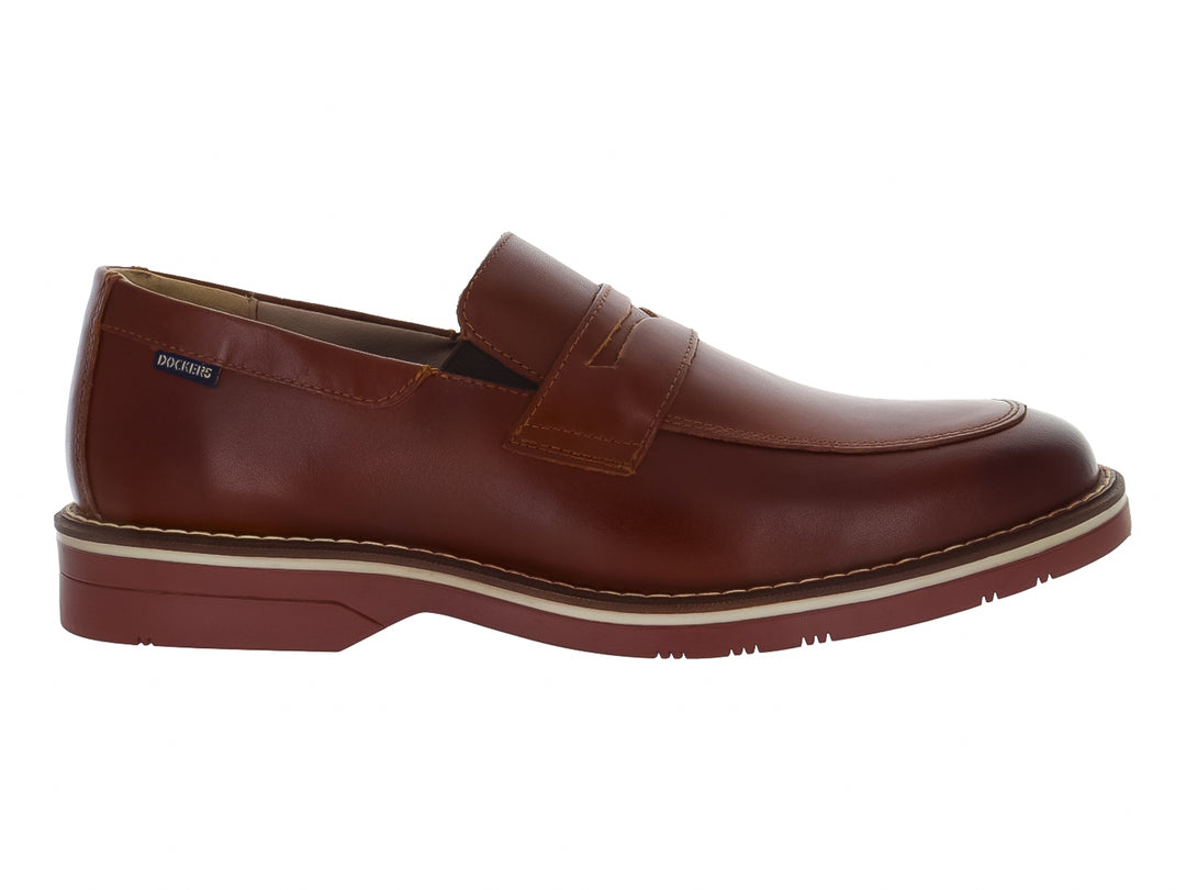 Zapato mocasín Dockers color cognac con suela blanca y marrón, diseño casual elegante para hombre.