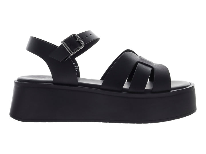 Sandalia de plataforma color negro con correas frontales y hebilla ajustable en el tobillo.