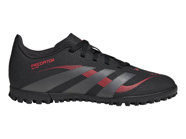 Calzado de fútbol Adidas Predator en color negro con franjas grises y detalles rojos para pasto sintético.