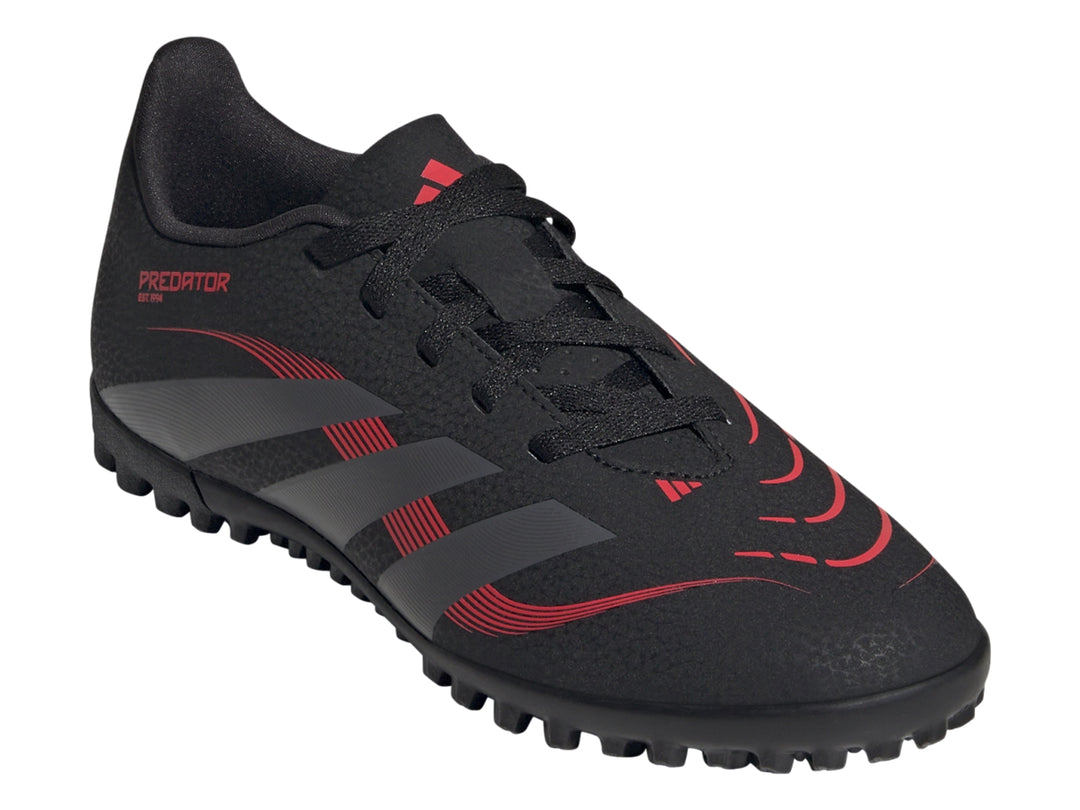Calzado de fútbol Adidas Predator en color negro con franjas grises y detalles rojos para pasto sintético.