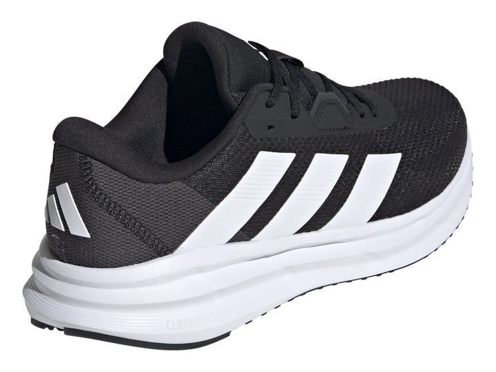 Tenis Adidas Galaxy 7 color negro con franjas y suela blanca, vista lateral.