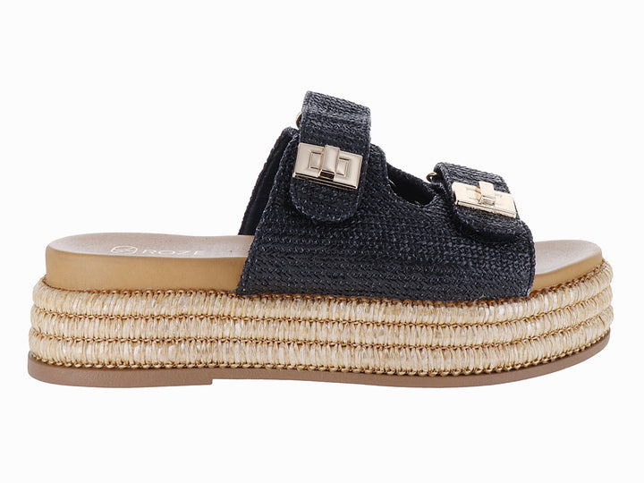 Sandalias de plataforma color negro con suela de yute tejido y hebillas doradas.