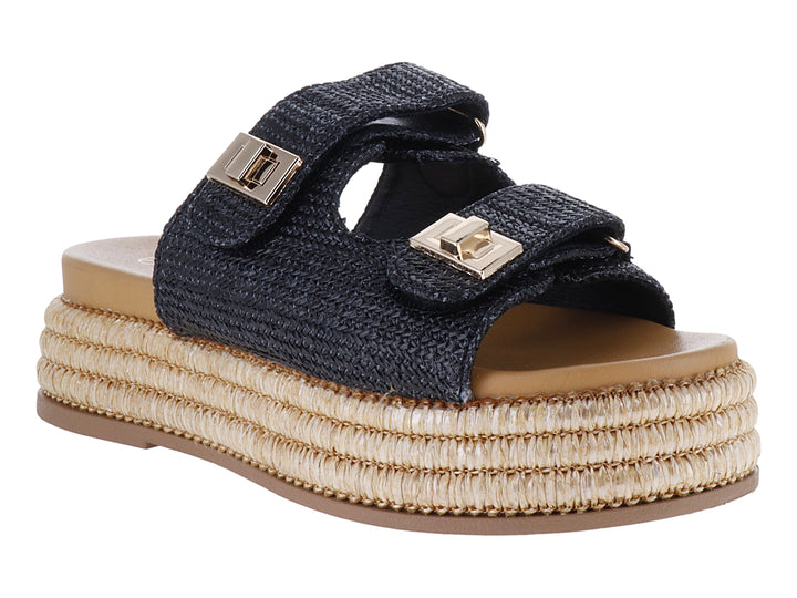 Sandalias de plataforma color negro con suela de yute tejido y hebillas doradas.